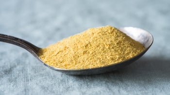 Health: Diet and nutrition: closeup nutritional yeast on spoon 1387751080