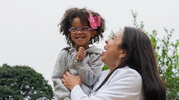 Health: autism: mother and daughter portrait outside-1354422075