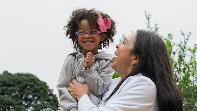 Health: autism: mother and daughter portrait outside 1354422075