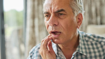 Health: Oral: senior man jaw pain-1326037796