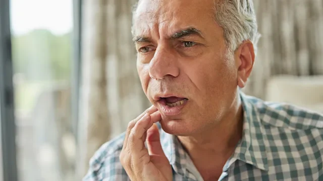 Health: Oral: senior man jaw pain-1326037796