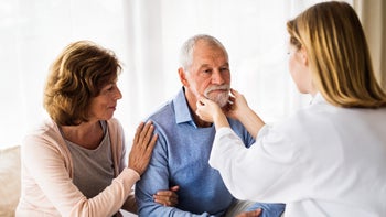 ace-inhibitors: providers: doctor checking patients jaw-876474692
