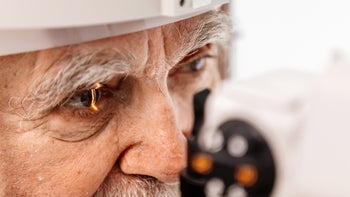 Eye: senior man at ophthalmology exam 1807533289