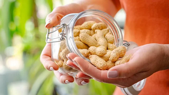 diet-nutrition: handful of peanuts 2213158137