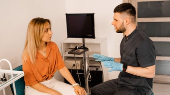 Long COVID: Check-up: patient and doctor talking 1405376271