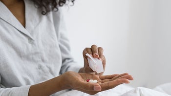 Medication: Pills: close up woman with pillbox 1348611263