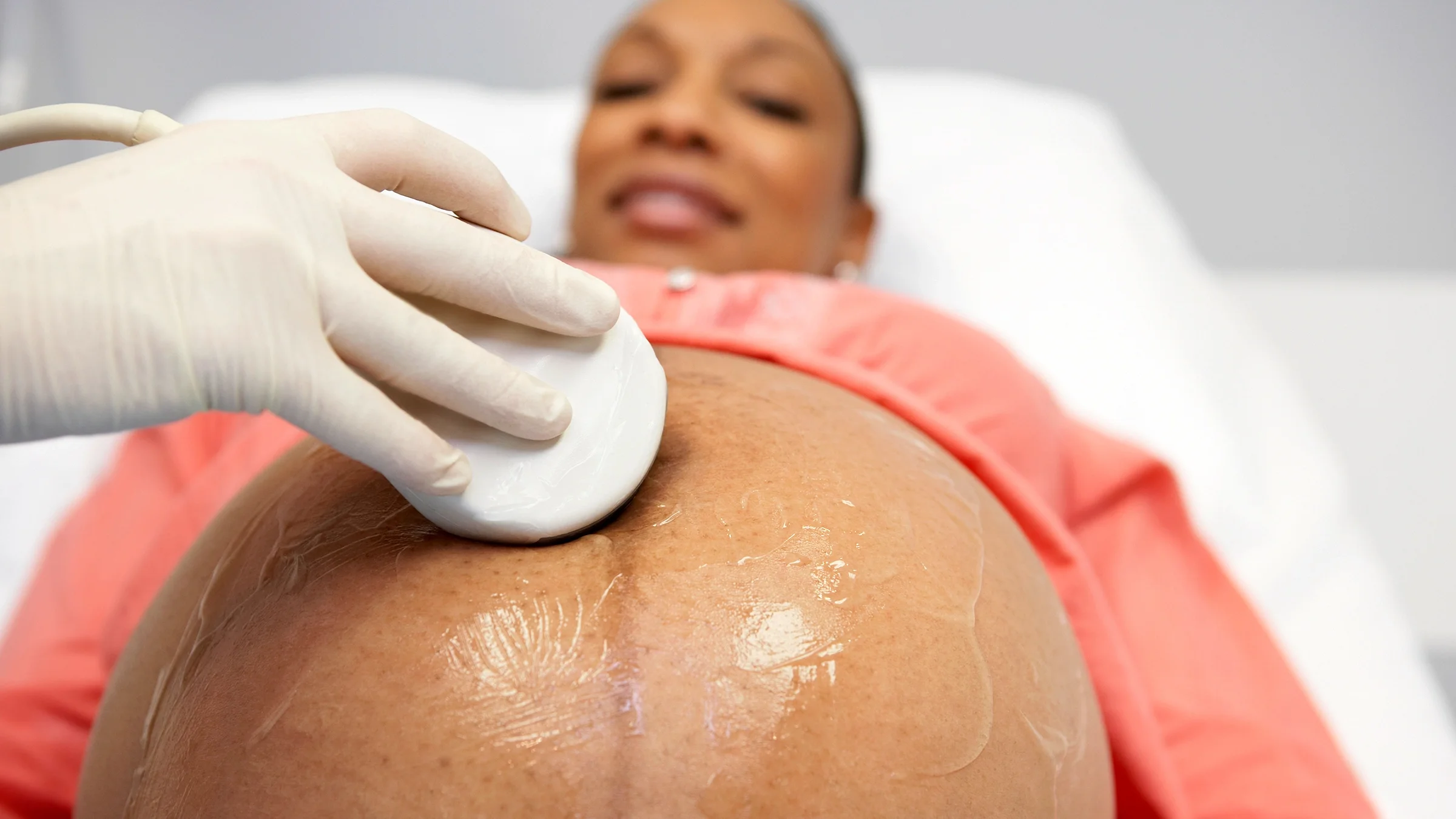 Close-up of a pregnant woman having an ultrasound.