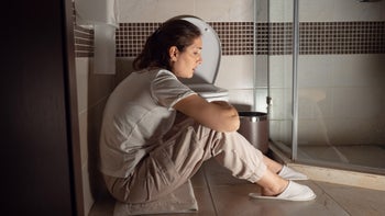 Food poisoning: stomach flu: crouched on bathroom floor 1345542537