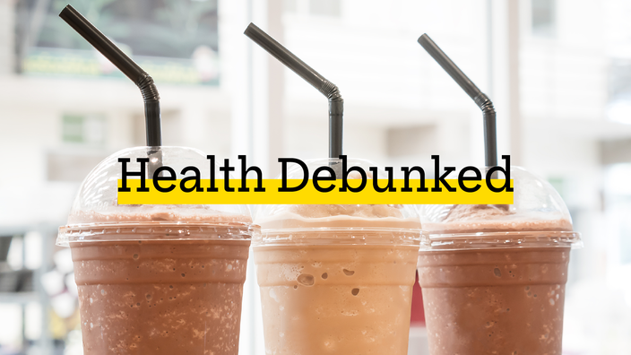 Three coffee frappes lined up with black bendy straws. There is added text on top reading “Health Debunked” with a yellow highlight bar behind it.
