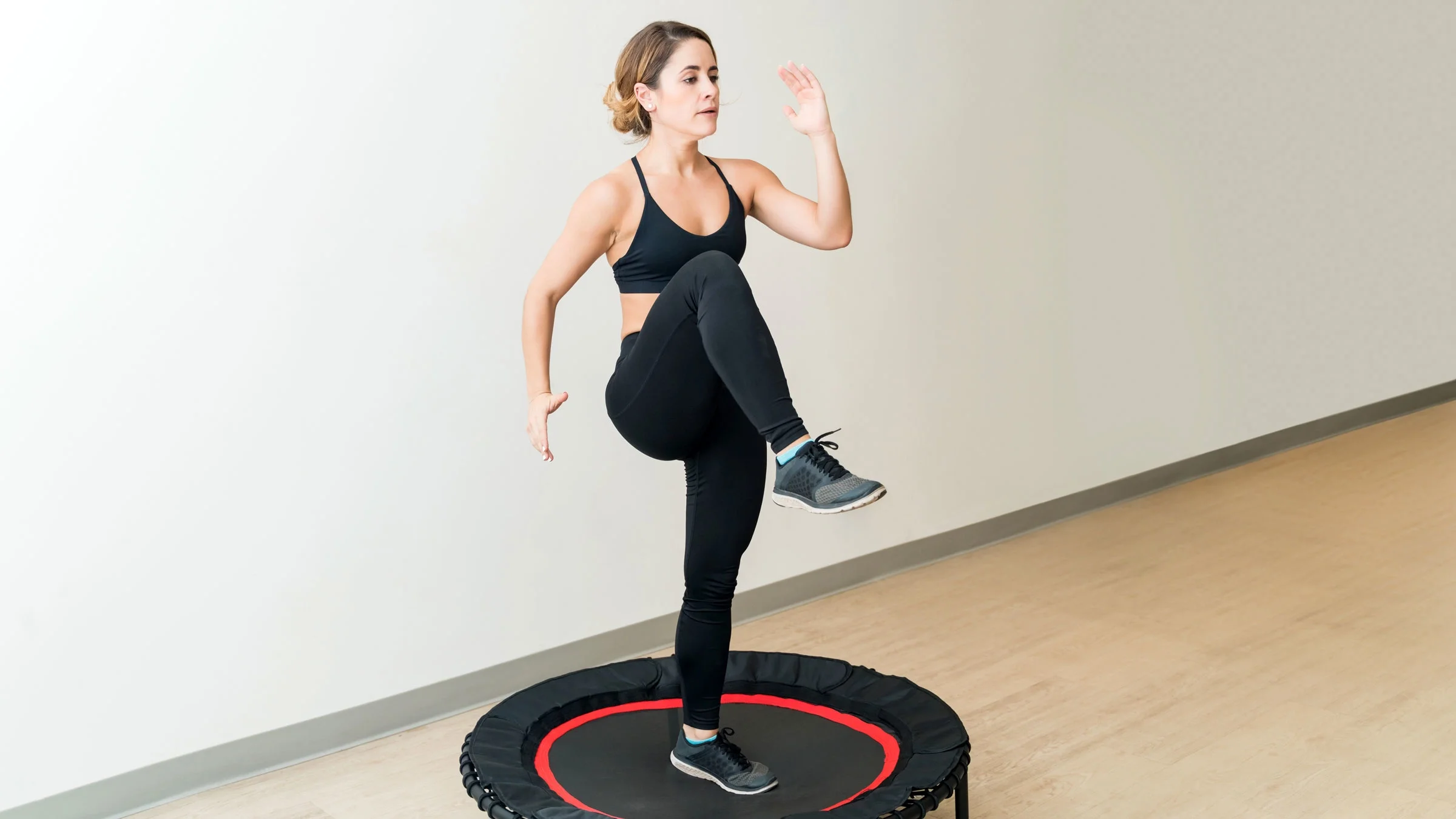 Woman doing trampoline exercise.