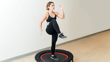 Movement exercise: woman trampoline exercise 1168065035