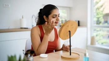 dermatology: woman applying face cream 2224252497(1)