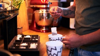 diet nutrition: closeup man making tea 1089349322