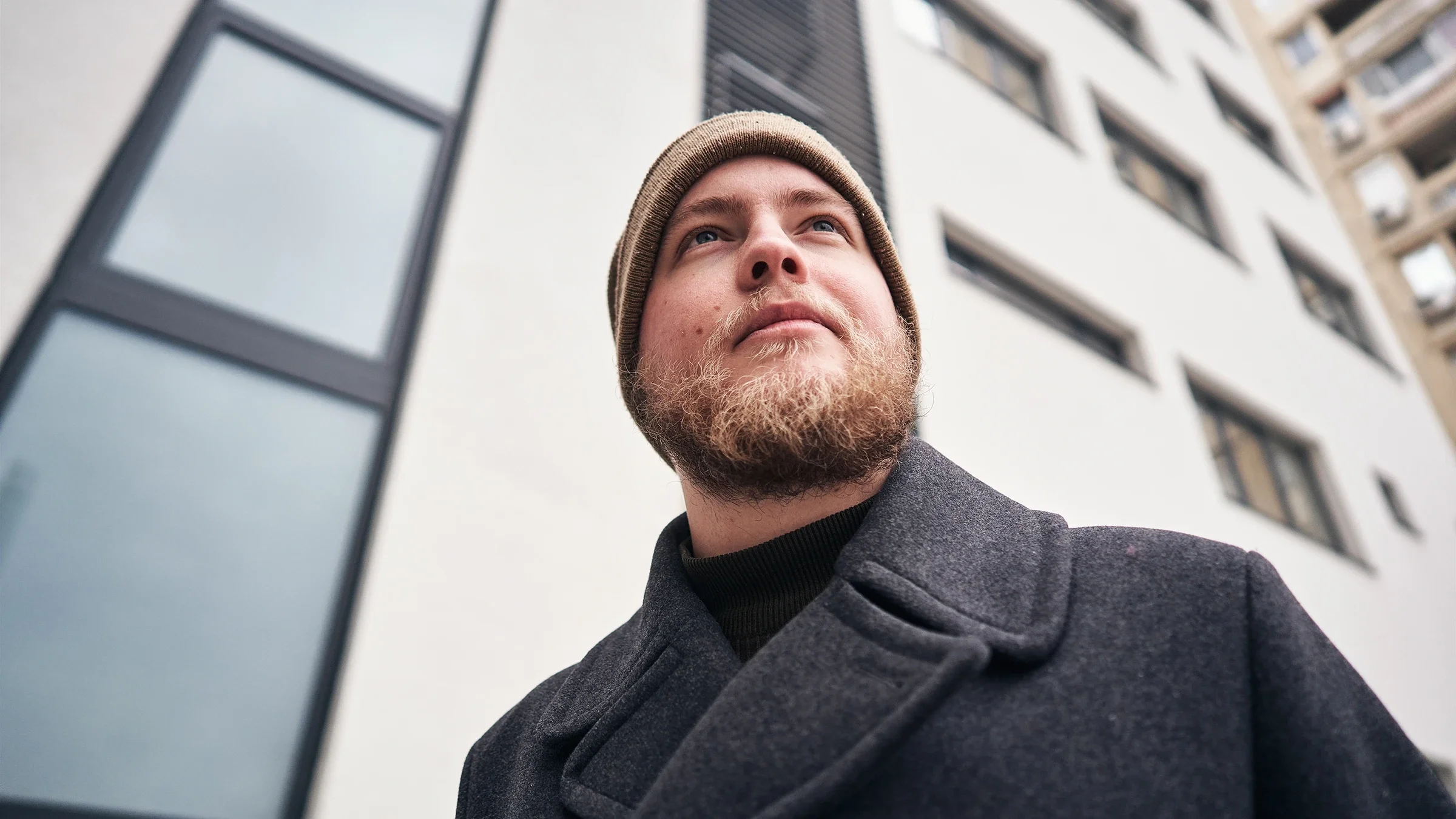 Man going for a winter morning walk around the neighborhood.