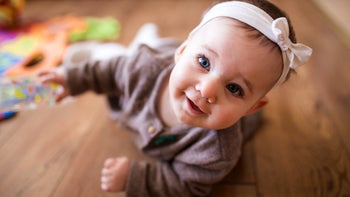 Children's Health: baby crawling on floor 908543278