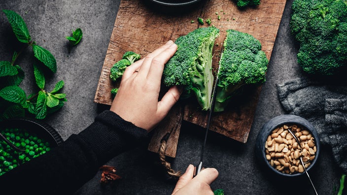 plan view of a half of savoy cabbage plant, on wooden table Stock Photo