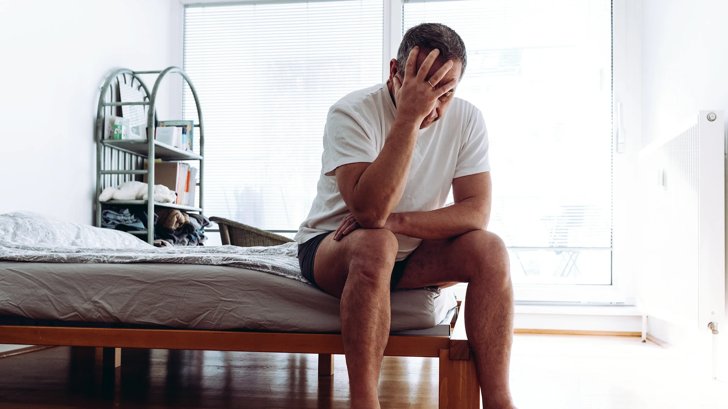 ED: Erectile Dysfunction: Men's Health: man sitting on edge of bed 1463408861