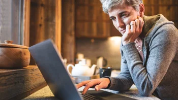 Health: Medicare: older adult on laptop 494315952