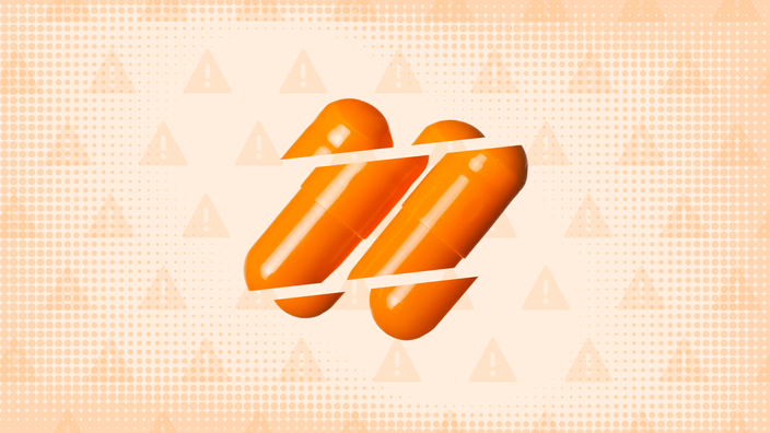 Light orange background with texture and warning sign pattern. In the center are two orange capsule pills cut into thirds.
