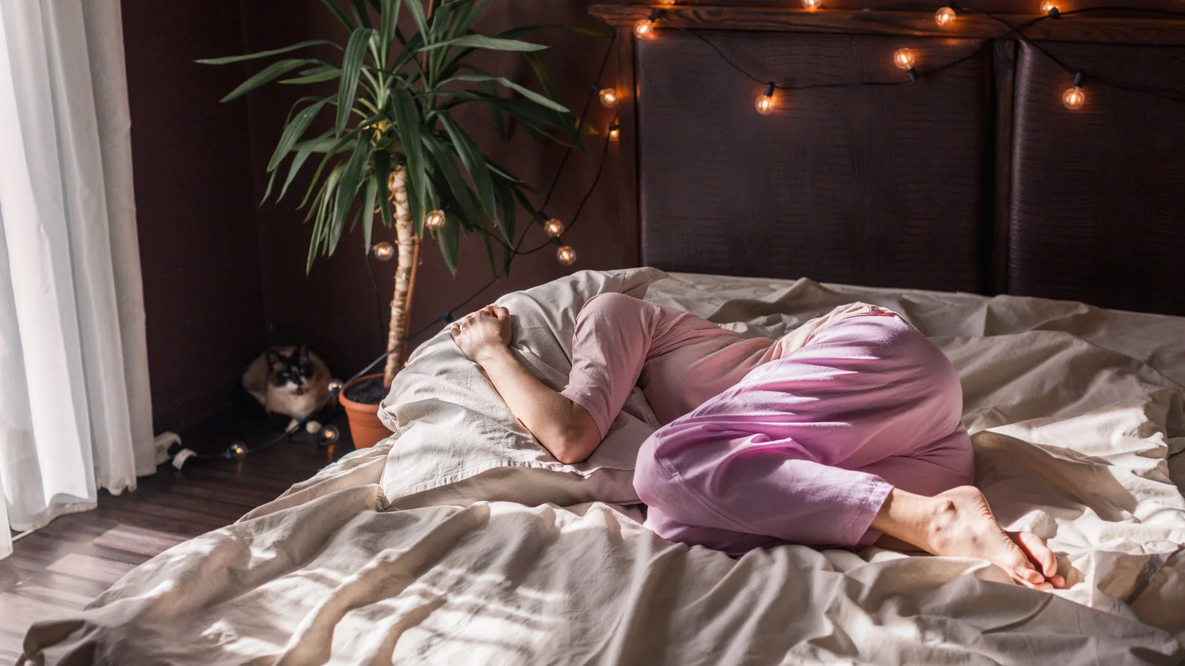 A person experiencing chronic pain in bed.
TatyanaGl/iStock via Getty Images Plus 