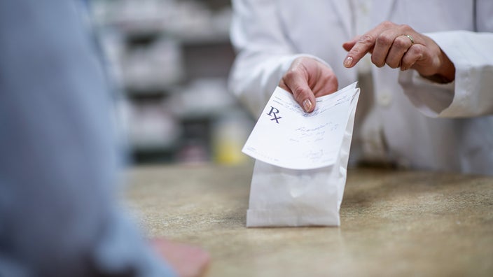 Close-up of a medication pick-up at a pharmacy counter