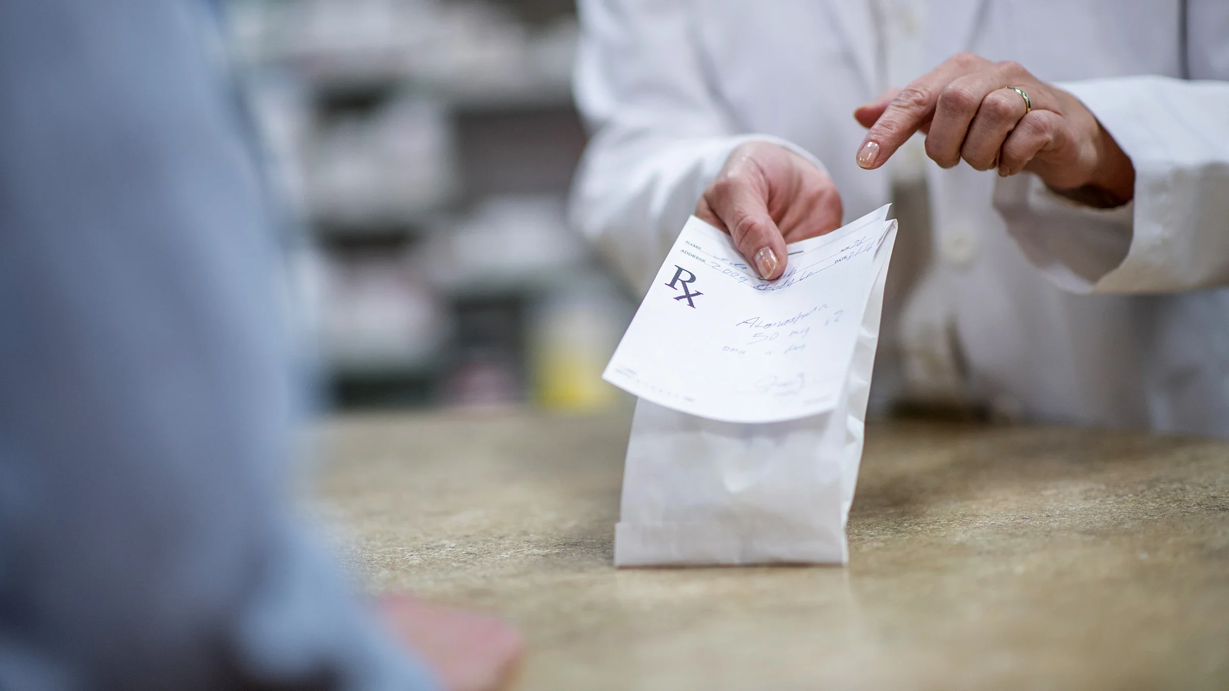 Close-up of a medication pick-up at a pharmacy counter
FatCamera/E+ via Getty Images