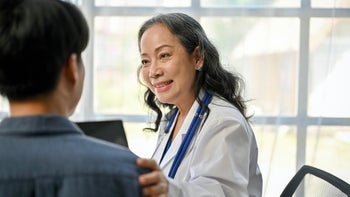 Autoimmune: doctor talks to patient 1532956417