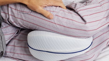 Sleep: Sciatica: closeup pillow between knees 1202702437