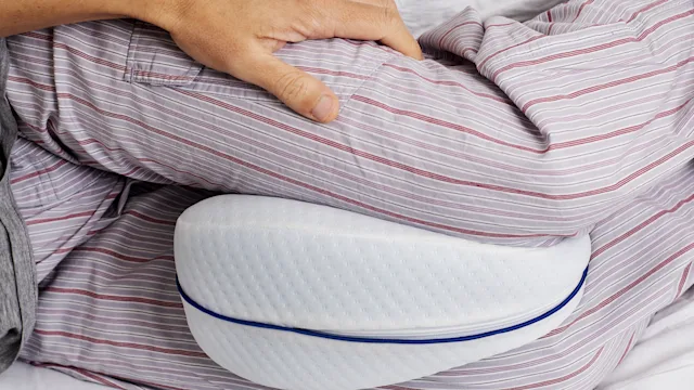 Sleep: Sciatica: closeup pillow between knees 1202702437