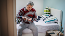 A man takes his daily medication.
Nes/E+ via Getty Images
