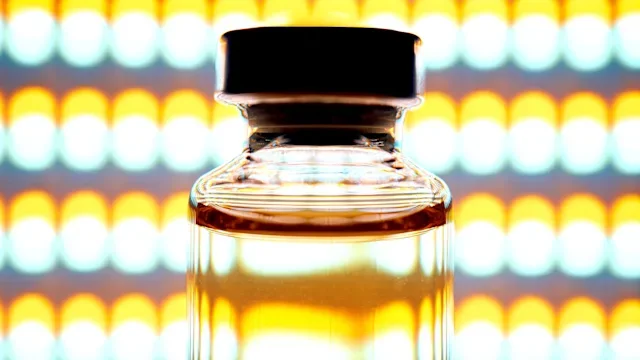 Peptides: vial in front of yellow lights 2279714190