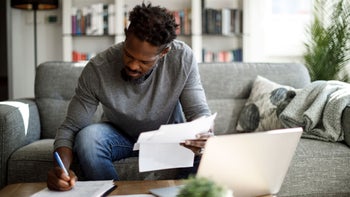 Health: Insurance: man finances at home 1422826927