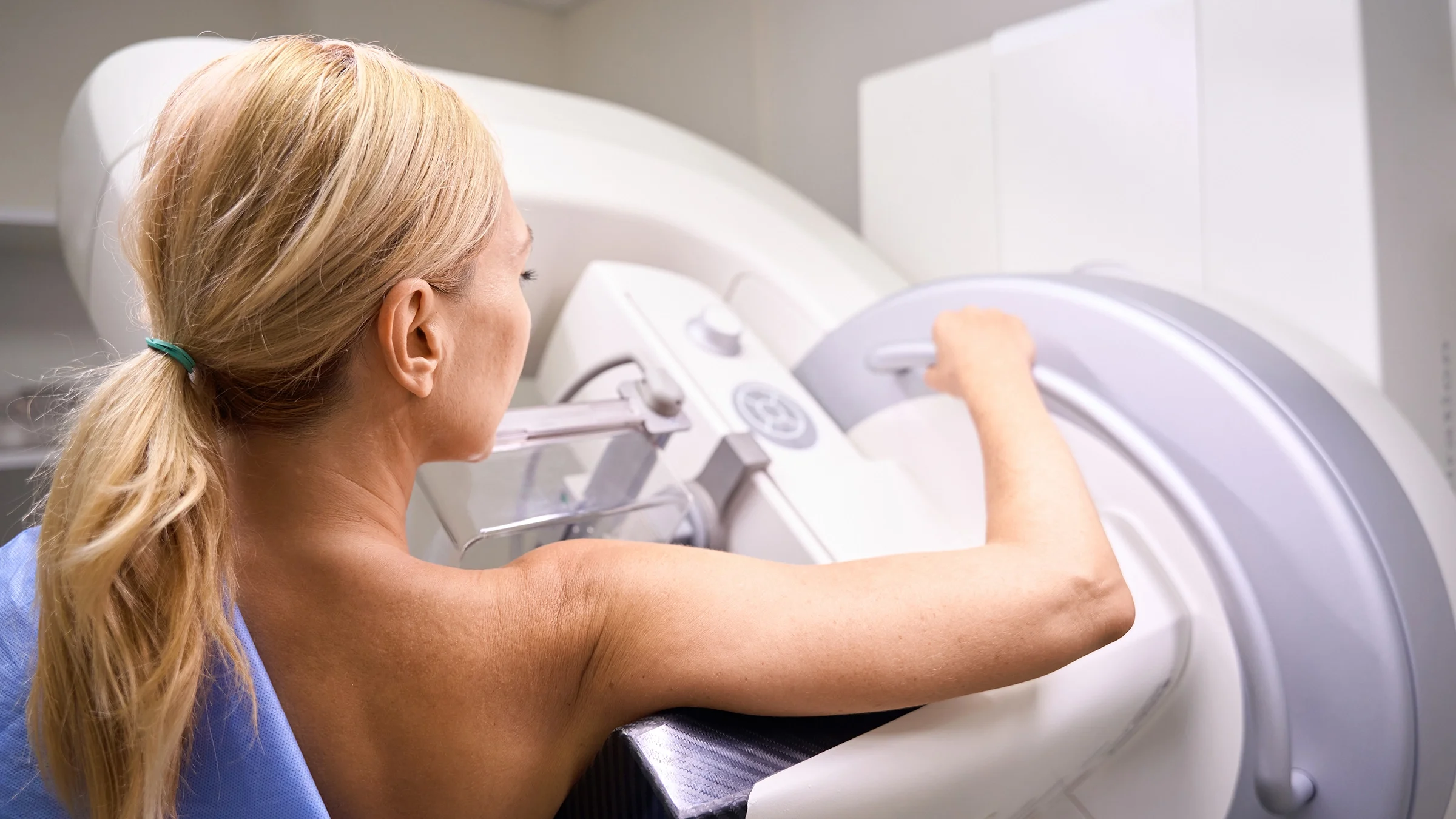 Woman getting a 3D mammogram.