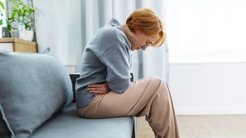 Irritable-bowel-syndrome: woman with stomachache 2195215645