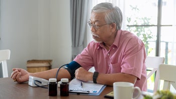 lisinopril: man checking blood pressure 2203989600