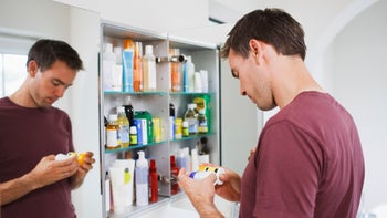 Urology: looking at pill bottles bathroom 107429913