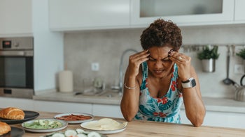nurtec: woman suffering from a migraine 2163233315