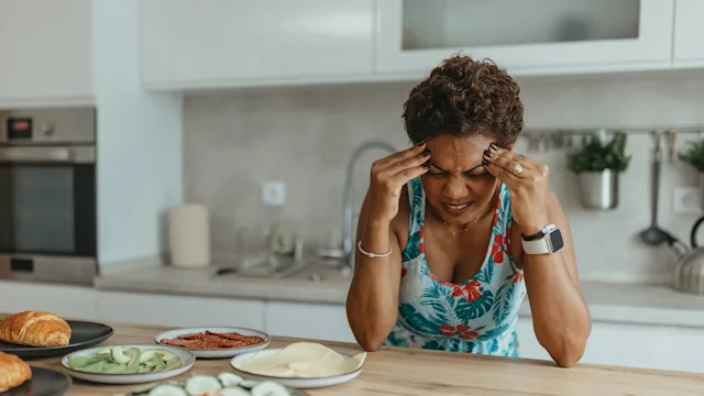 nurtec: woman suffering from a migraine 2163233315