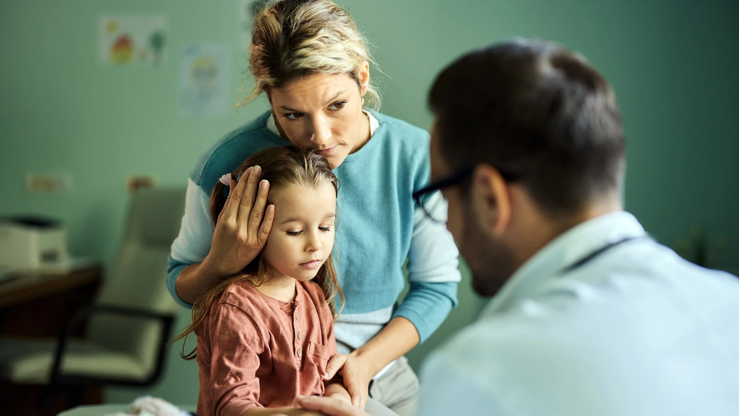 Mother and her daughter at a medical appointment.