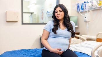 iron-supplements: pregnant woman at medical exam 2111039548
