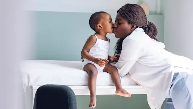 mother child doctors office-1219507045