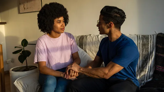 Mental health: Self-harm addiction: couple holding hands tough conversation 1488963762