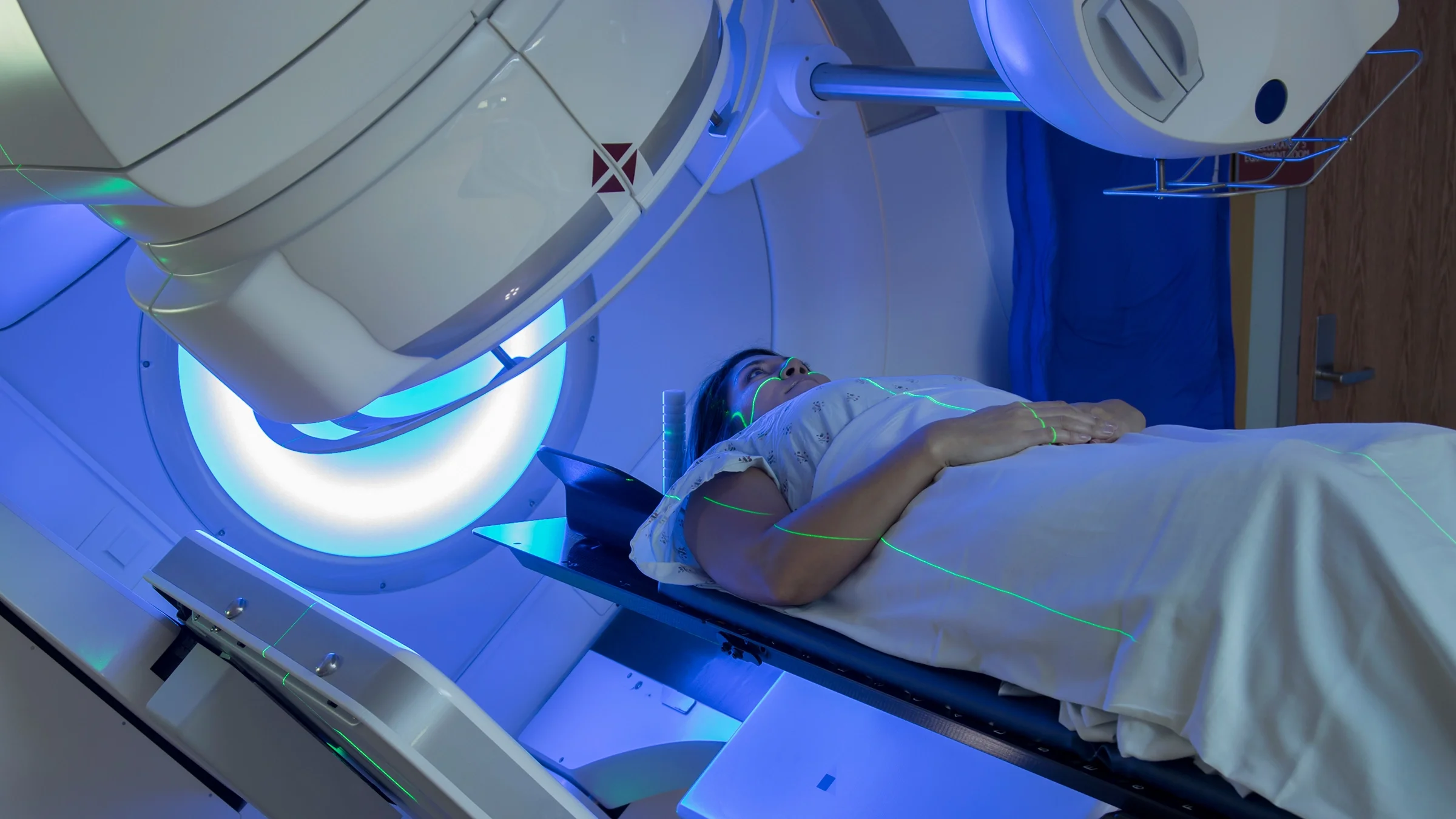 Woman receiving radiation treatment.
