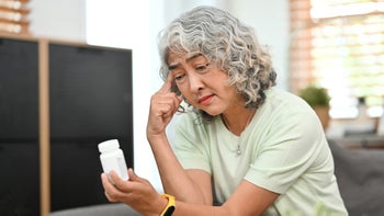 Pharmacy: Finance: woman worried about medication 1464932784
