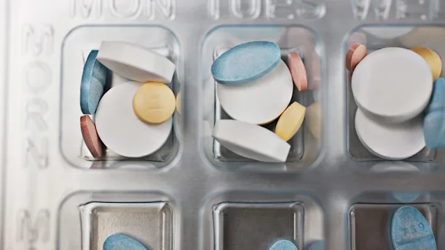 Medication education: close-up daily pill organizer 107429783