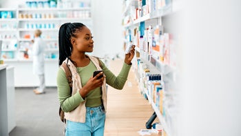 Dermatology: adult shopping at a pharmacy 1419247039