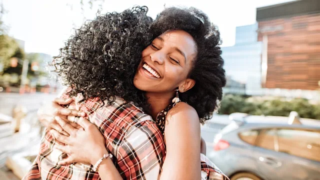 Eating disorders: Support: friends hugging sunning day-814850652