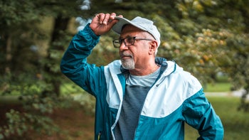 Hair loss: man wearing a baseball cap 2181252909
