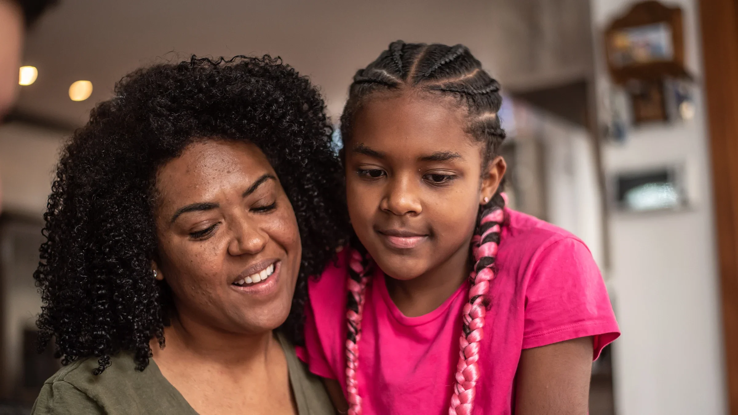 A mom talks with her daughter. A child’s first period is a big adjustment for parents and children alike. Knowing the signs and talking about it can help you both get prepared.
Drs Producoes/E+ via Getty Images