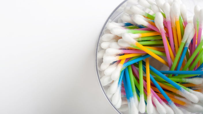 Colorful q-tips in a bowl. 